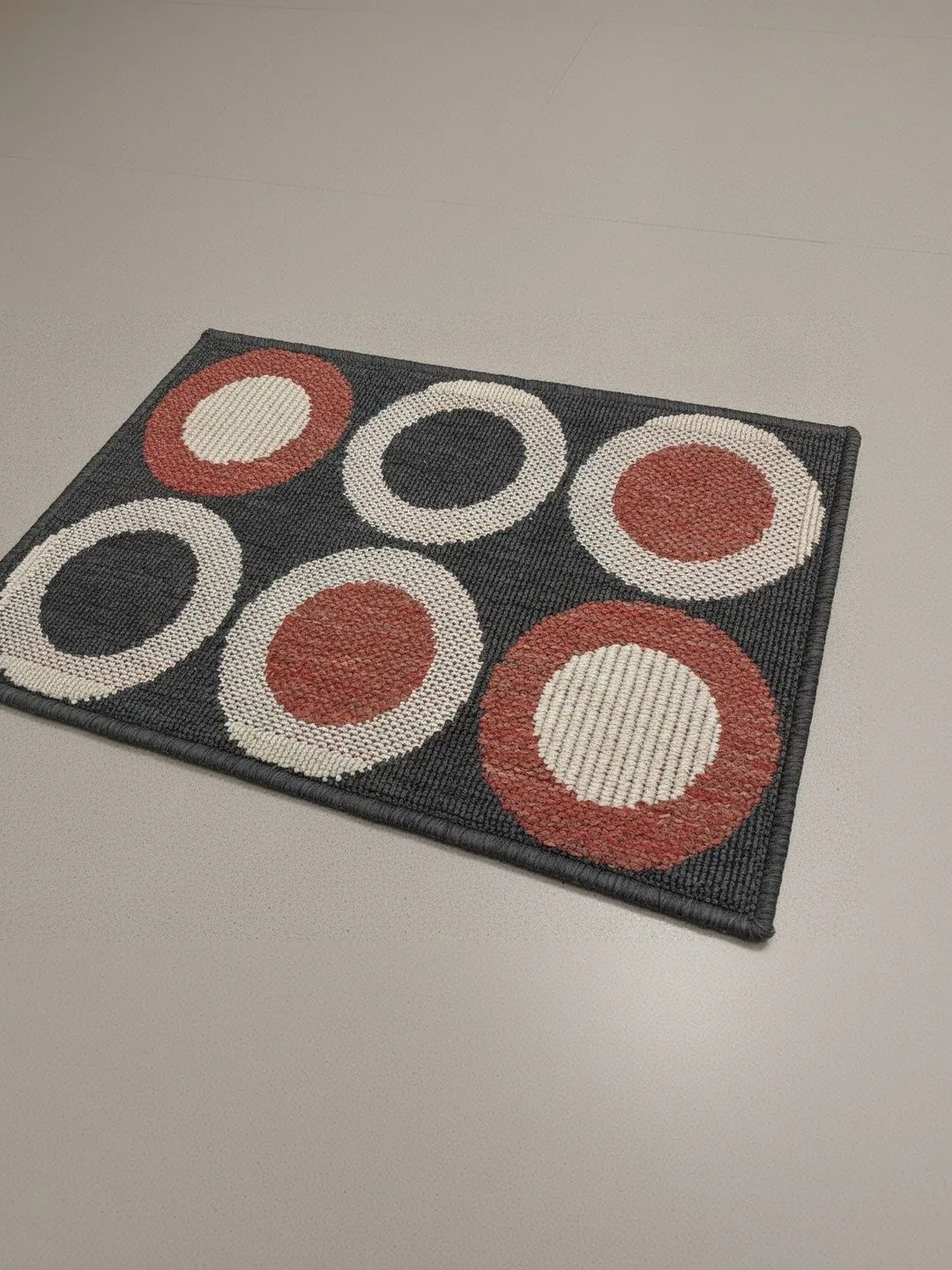 Charcoal Circle Print Anti-Skid Doormat 60 x 40 cm in charcoal & terracotta, backing detail
