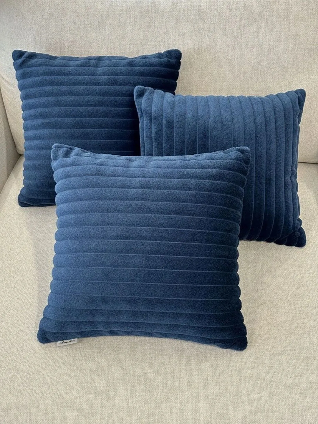 Navy Blue Channel Ribbed cushion covers, set of 3, 16 x 16 inch, styled on a sofa